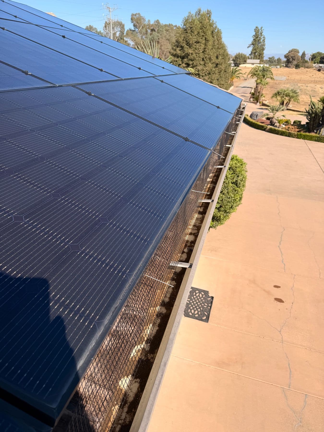 Critter guard mesh installed around the edge of a solar array