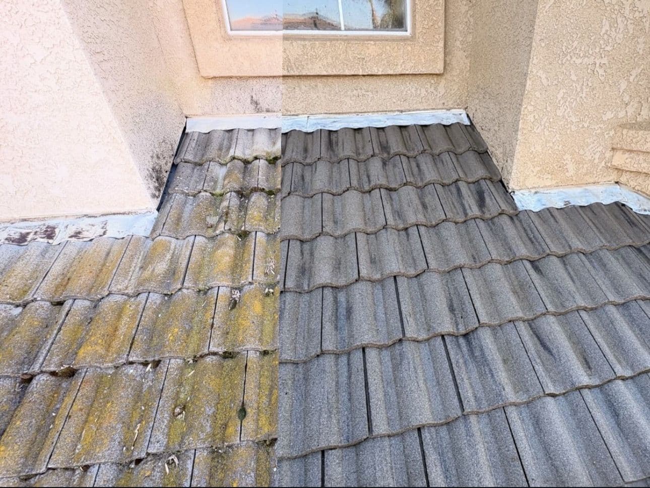 Concrete tile roof half washed, mossy tiles on the left and clean tiles on the right